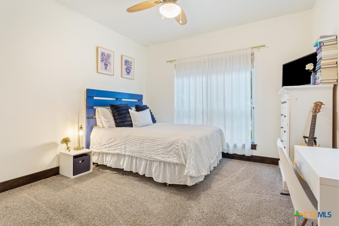 569 Messer Ranch Road Belton, TX 76513 - Photo 21 of 48 a bedroom with a bed and a flat screen tv