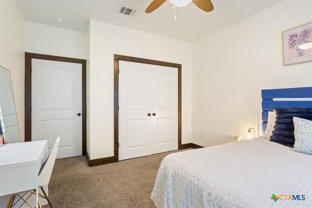 569 Messer Ranch Road Belton, TX 76513 - Photo 22 of 48 a bedroom with a bed and a chair
