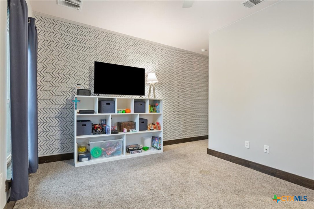 569 Messer Ranch Road Belton, TX 76513 - Photo 25 of 48 a living room with furniture and a flat screen tv