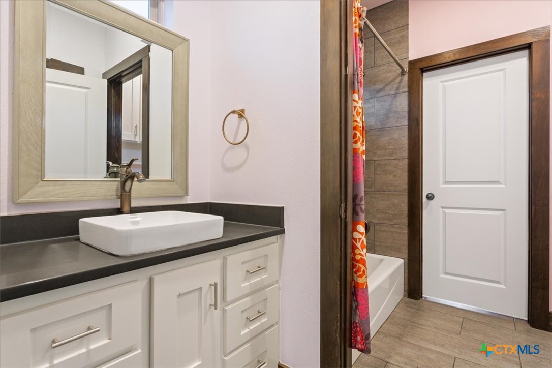 569 Messer Ranch Road Belton, TX 76513 - Photo 28 of 48 a bathroom with a sink and a mirror