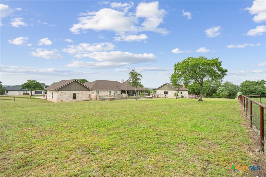 569 Messer Ranch Road Belton, TX 76513 - Photo 46 of 48 a view of a lake with a house in the background