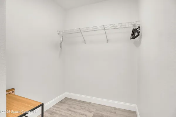 a view of a room with racks on the wall