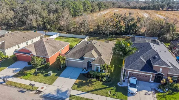 an aerial view of houses with yard