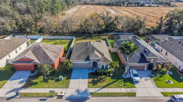 an aerial view of houses with yard