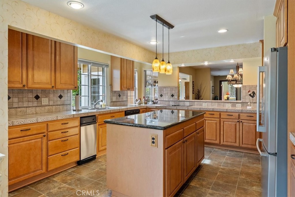 1505 Barley Grain Road Paso Robles, CA 93446 - Photo 13 of 56 a kitchen with a sink stove and cabinets