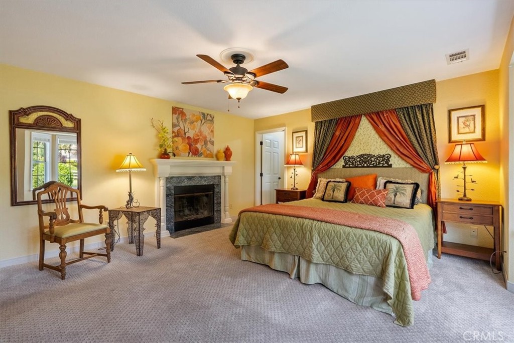 1505 Barley Grain Road Paso Robles, CA 93446 - Photo 18 of 56 a bedroom with a bed and a fireplace