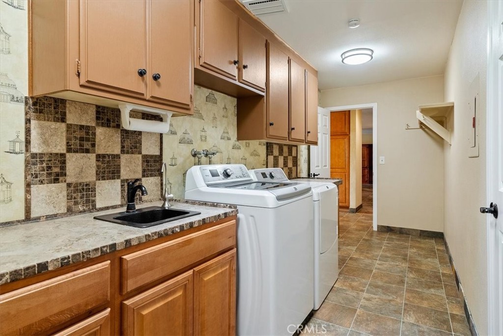 1505 Barley Grain Road Paso Robles, CA 93446 - Photo 23 of 56 a kitchen with stainless steel appliances granite countertop a stove a sink and a refrigerator