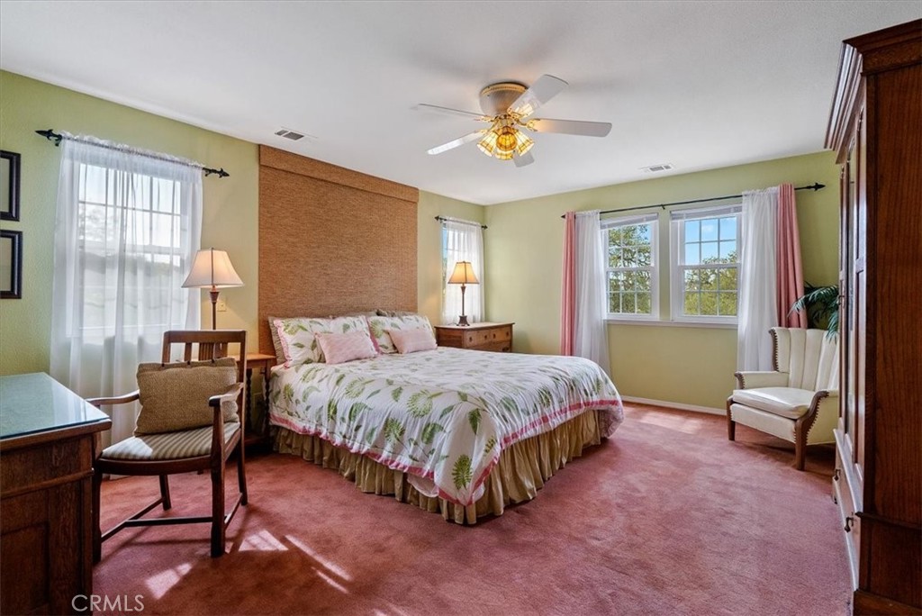 1505 Barley Grain Road Paso Robles, CA 93446 - Photo 26 of 56 a spacious bedroom with a bed and a chandelier