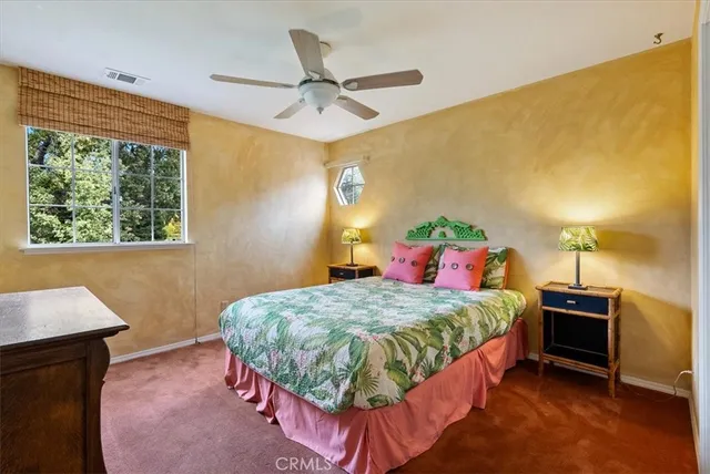 a front view of a house with a yard table and chairs