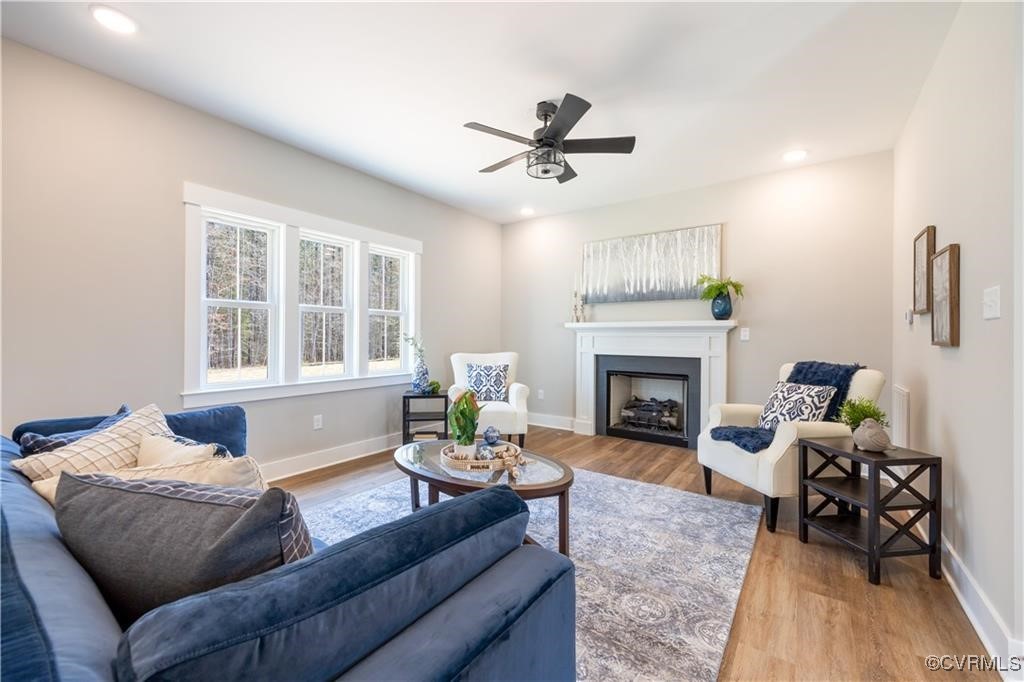 12036 Corte Castle Road Chesterfield, VA 23838 - Photo 13 of 31 a living room with furniture and a fireplace