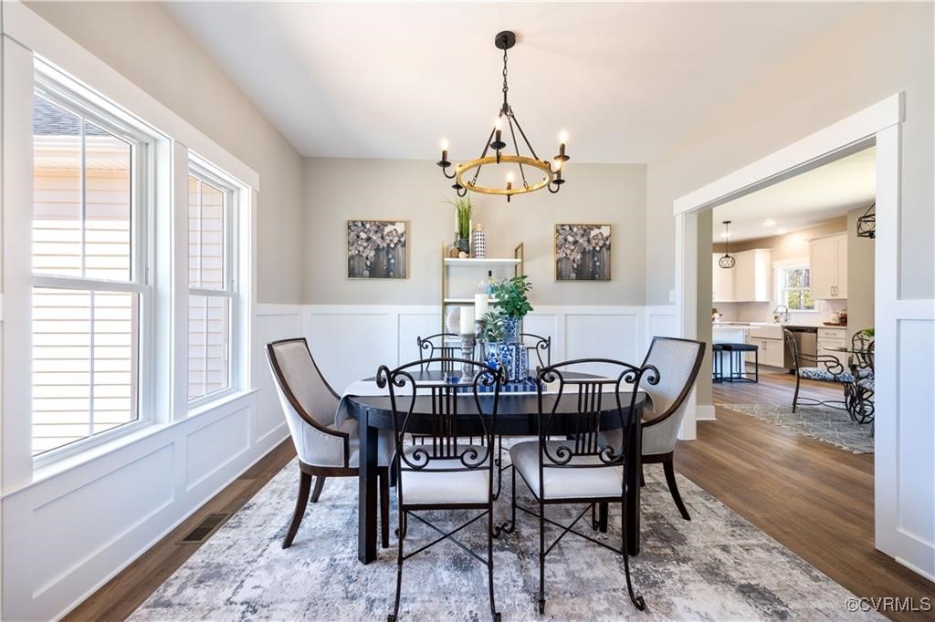 12036 Corte Castle Road Chesterfield, VA 23838 - Photo 14 of 31 a view of a dining room with furniture window and wooden floor