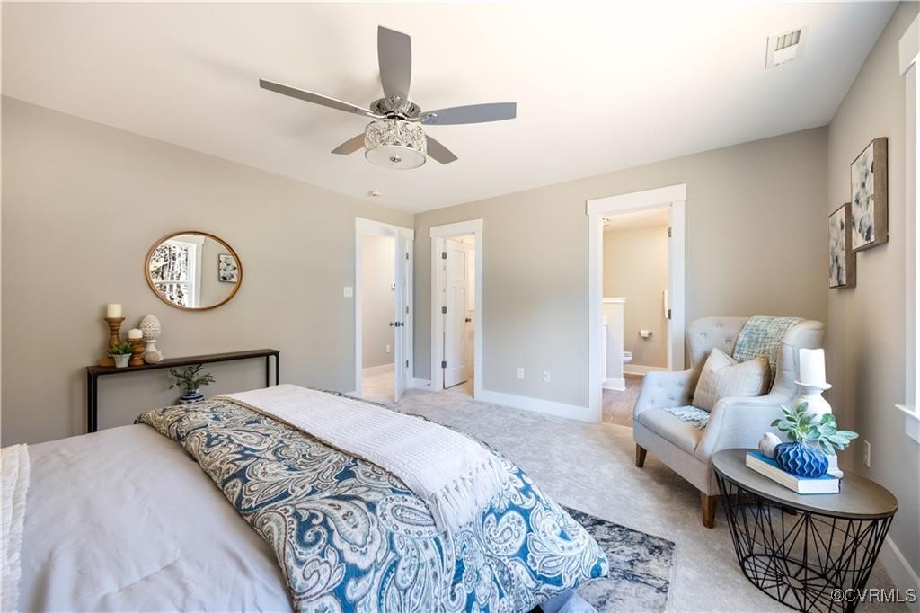 12036 Corte Castle Road Chesterfield, VA 23838 - Photo 18 of 31 a bedroom with a bed and a chandelier