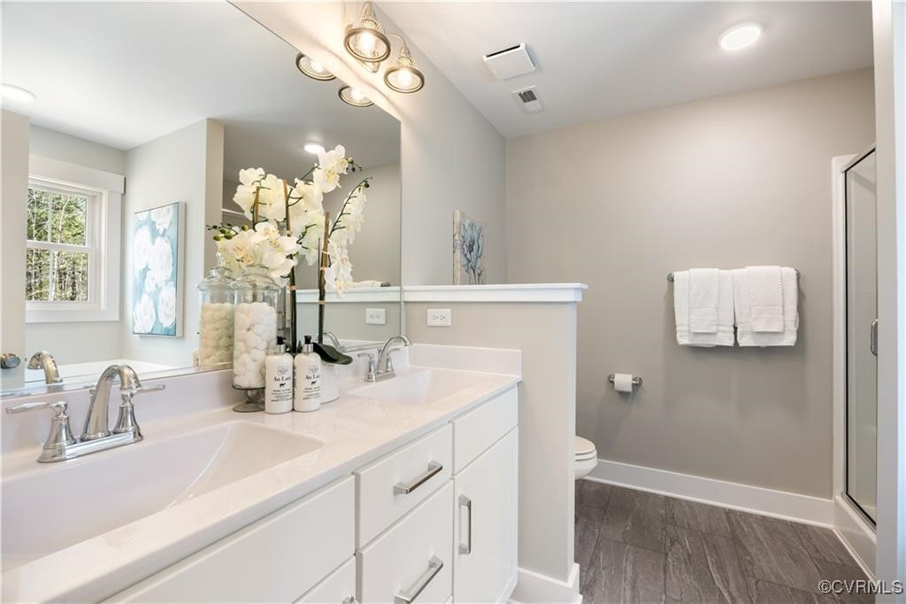 12036 Corte Castle Road Chesterfield, VA 23838 - Photo 19 of 31 a bathroom with a sink a vanity and a mirror