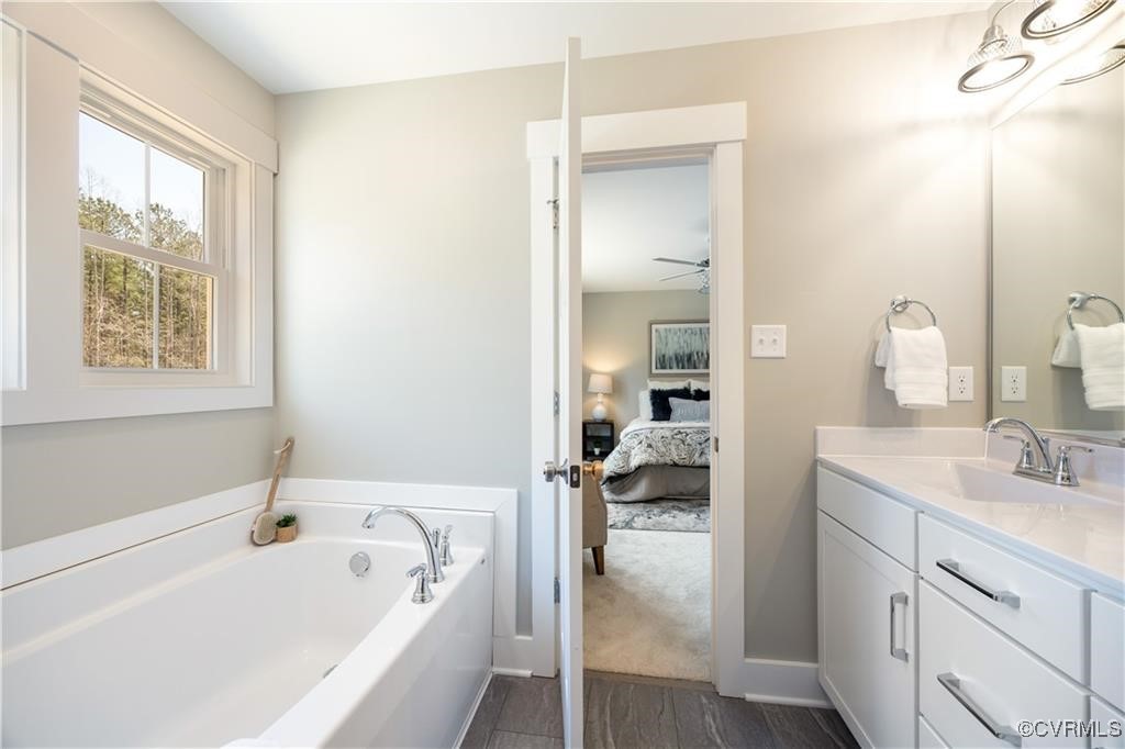 12036 Corte Castle Road Chesterfield, VA 23838 - Photo 20 of 31 a bathroom with a tub sink and mirror