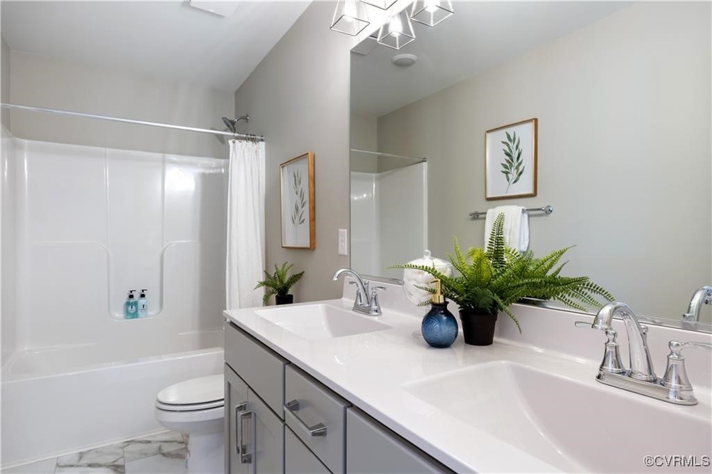 12036 Corte Castle Road Chesterfield, VA 23838 - Photo 25 of 31 a bathroom with a sink a toilet and a large mirror