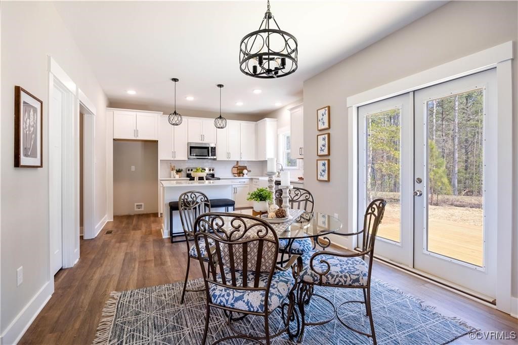 12036 Corte Castle Road Chesterfield, VA 23838 - Photo 7 of 31 a view of a dining room with furniture window and wooden floor