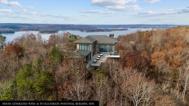 a view of a house with a yard and wooden fence