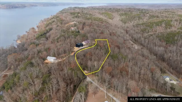a view of a lake with houses in the back