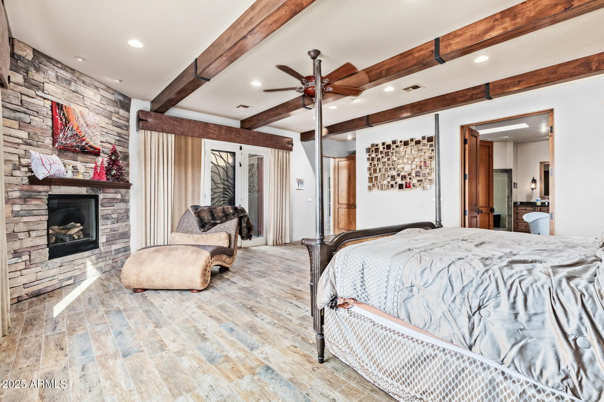 5100 East Cloud Road Cave Creek, AZ 85331 - Photo 17 of 43 a bed room with a bed and a fireplace