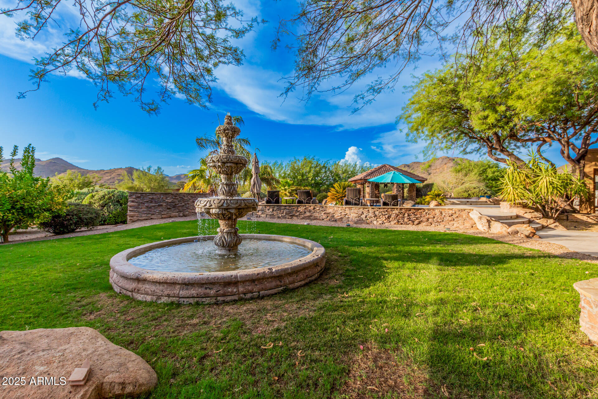 5100 East Cloud Road Cave Creek, AZ 85331 - Photo 28 of 43 a swimming pool with trees in the background