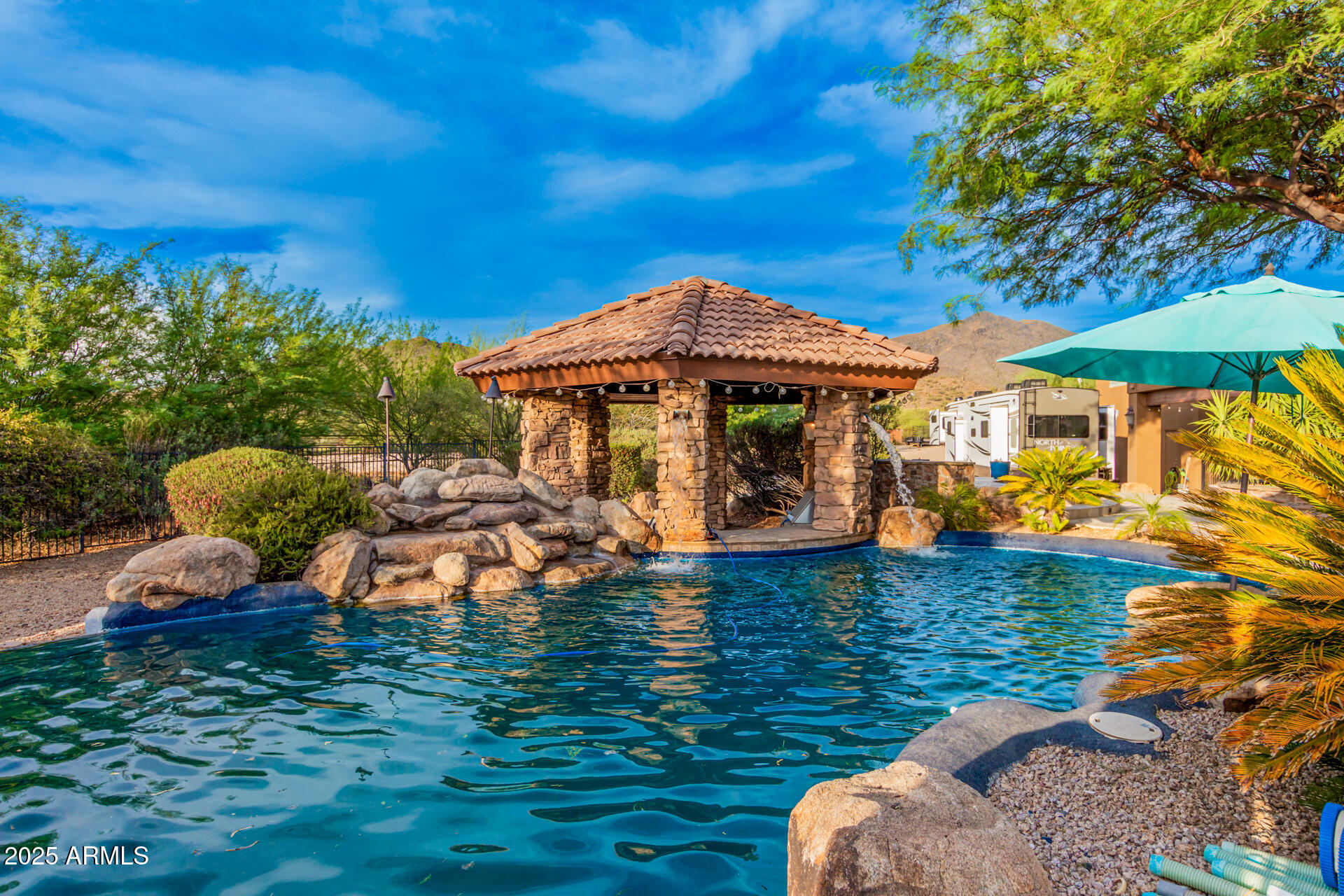 5100 East Cloud Road Cave Creek, AZ 85331 - Photo 29 of 43 a front view of a house with garden