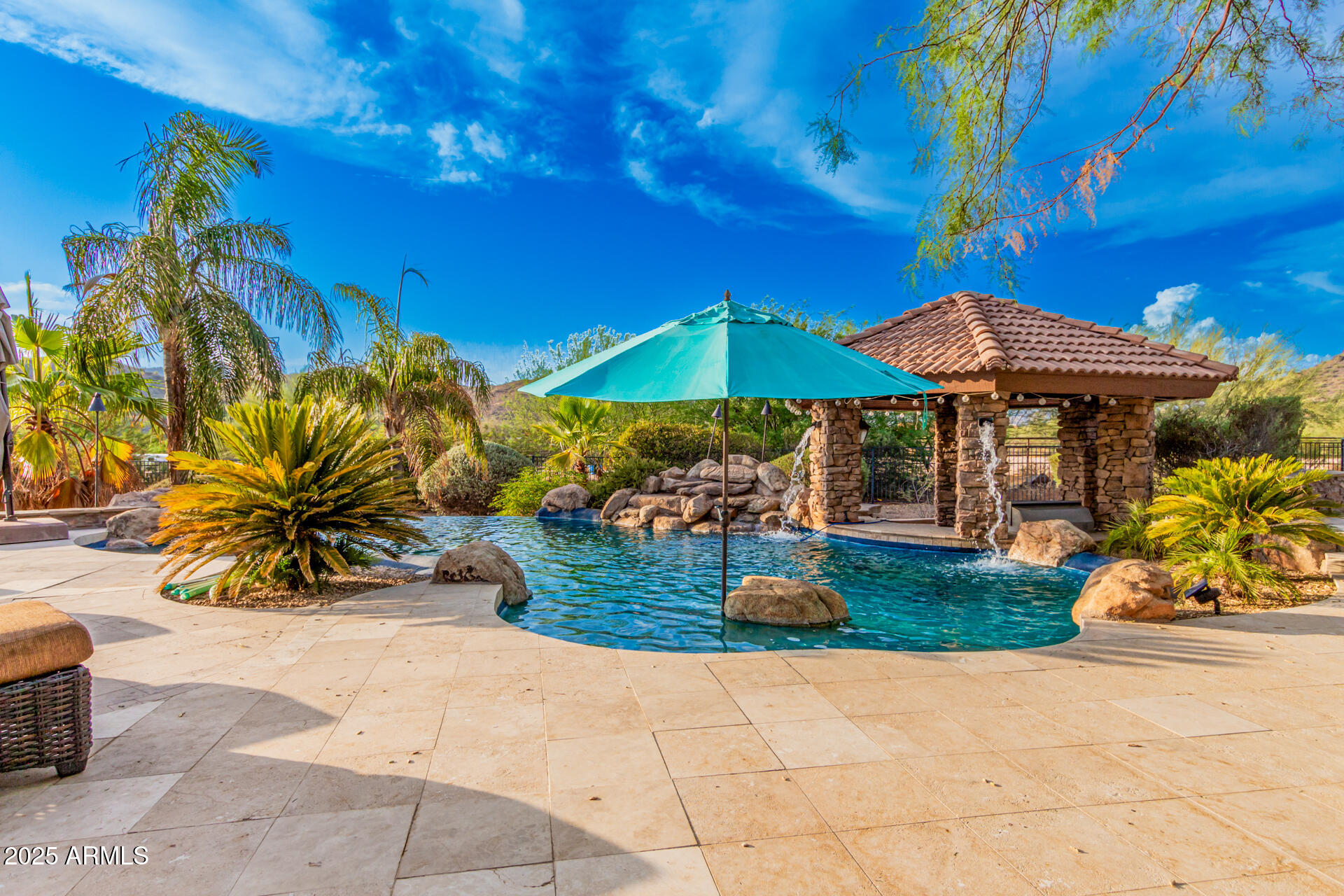 5100 East Cloud Road Cave Creek, AZ 85331 - Photo 32 of 43 a view of a table and chairs under an umbrella