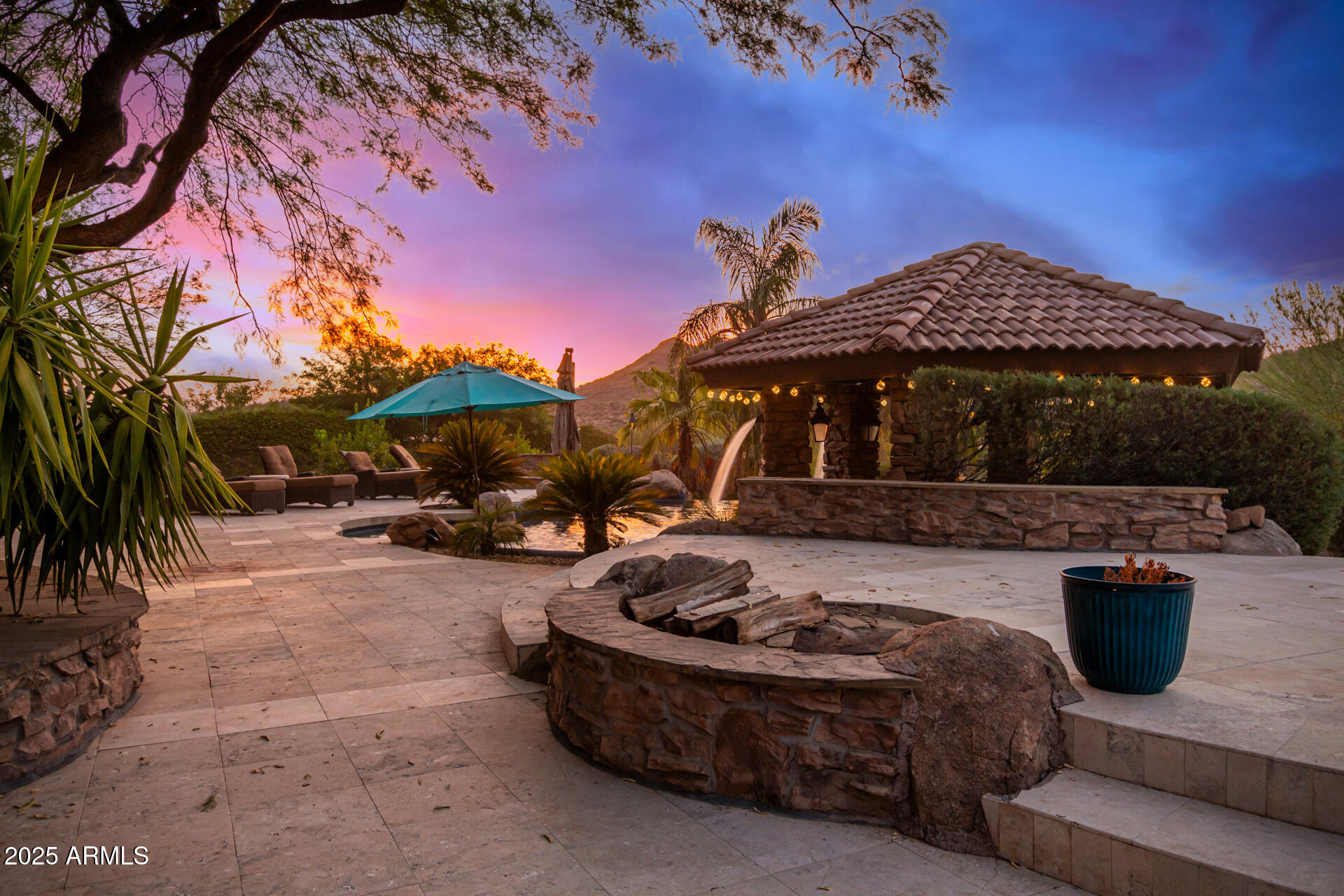 5100 East Cloud Road Cave Creek, AZ 85331 - Photo 36 of 43 a view of a patio with table and chairs with a fire pit and a yard