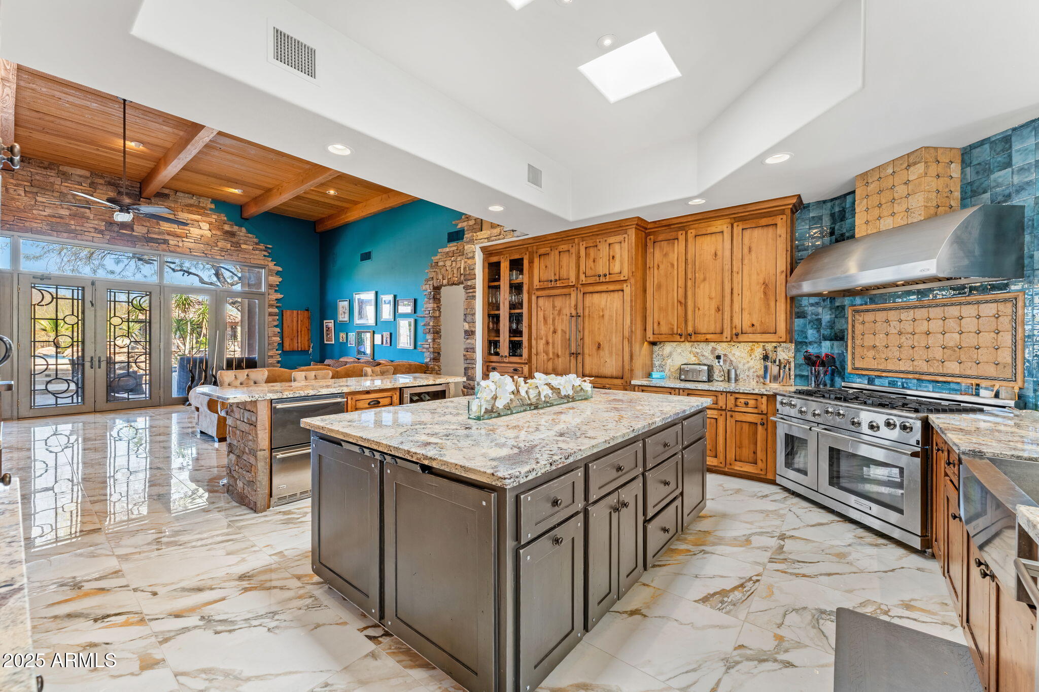 5100 East Cloud Road Cave Creek, AZ 85331 - Photo 7 of 43 a kitchen with stainless steel appliances granite countertop a stove a sink and a refrigerator