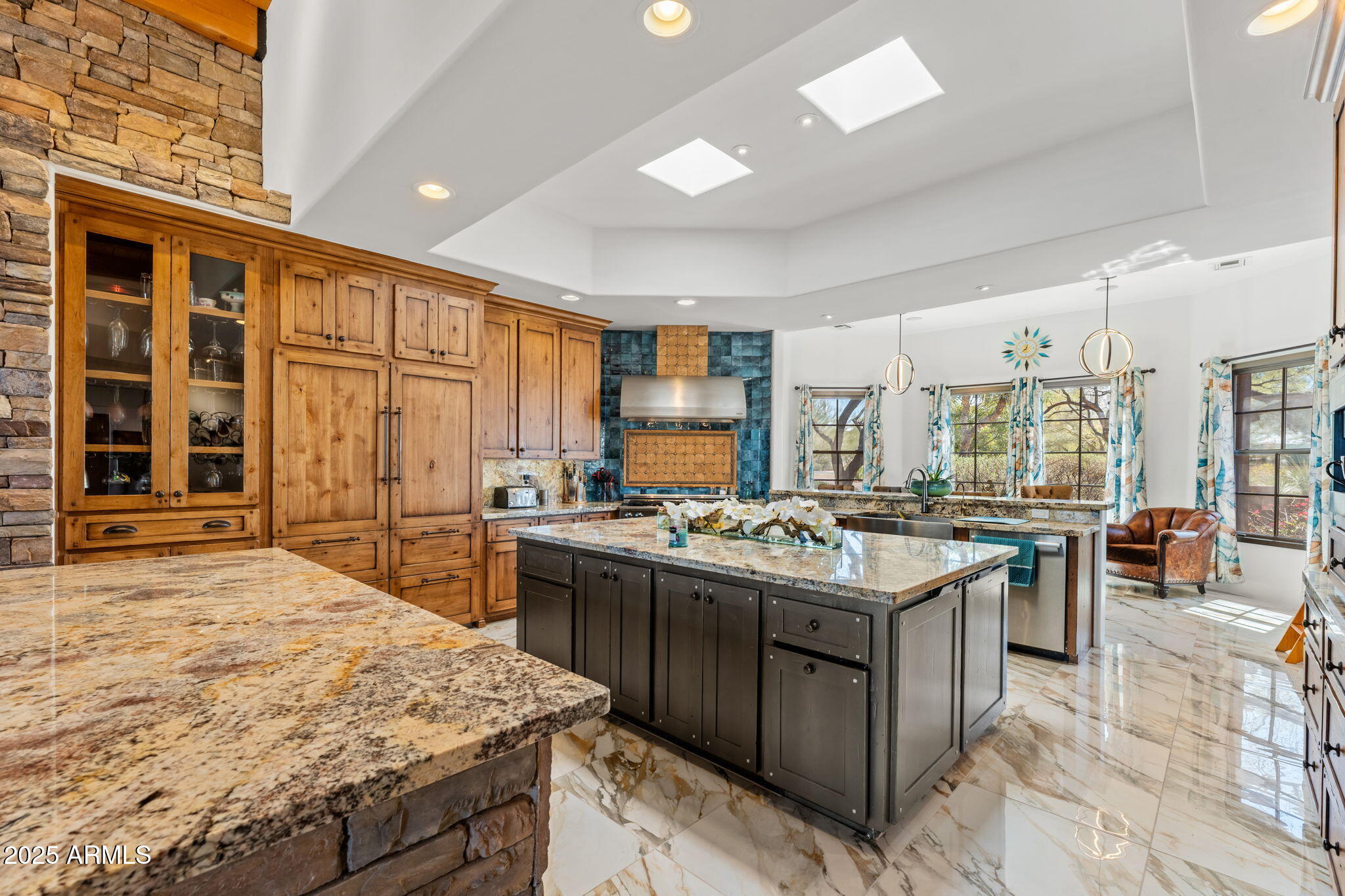 5100 East Cloud Road Cave Creek, AZ 85331 - Photo 8 of 43 a kitchen with stainless steel appliances granite countertop a stove and a sink