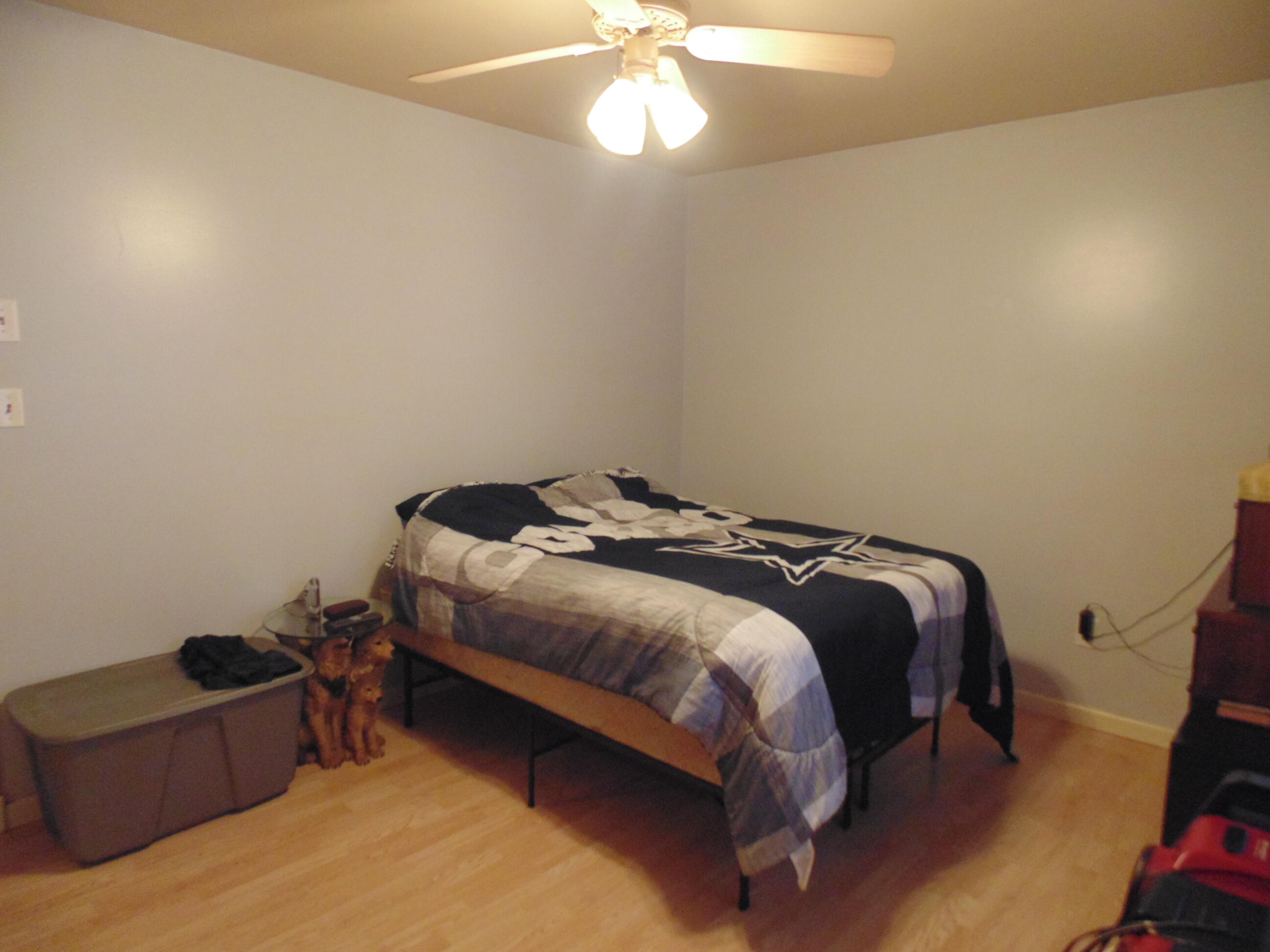 3170 Lawrence Street Hobart, IN 46342 - Photo 11 of 11 a bedroom with a bed and a chandelier