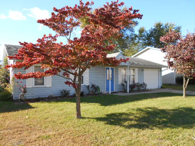 3170 Lawrence Street Hobart, IN 46342 - Photo 2 of 11 a view of a house with a swimming pool and a large tree