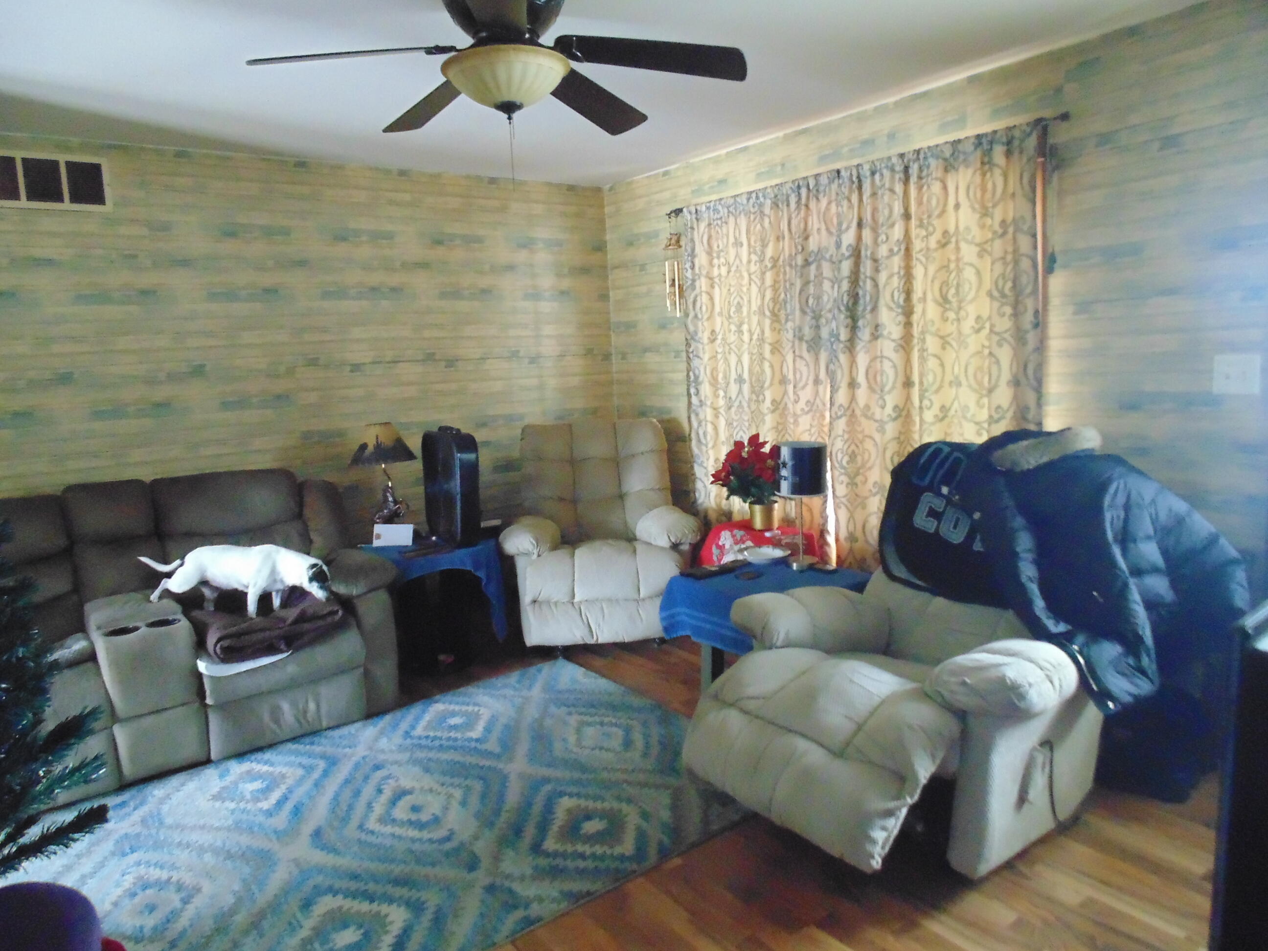3170 Lawrence Street Hobart, IN 46342 - Photo 6 of 11 a living room with furniture and a fireplace