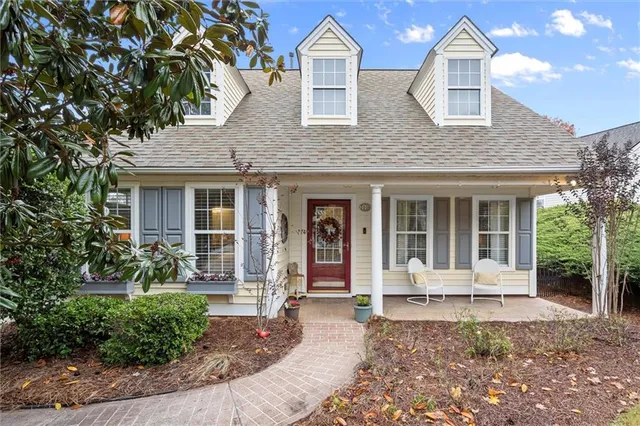 a front view of a house with garden