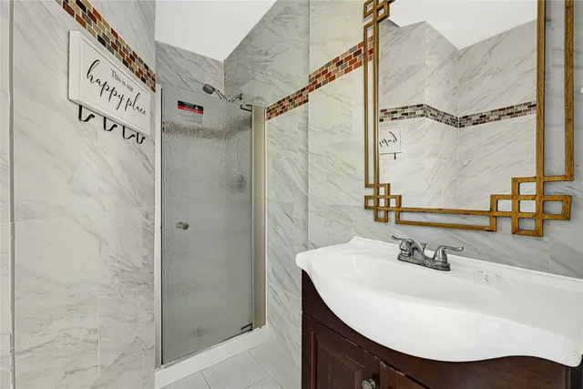 a bathroom with a sink and a mirror