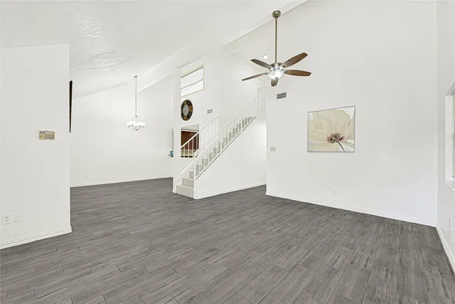 a view of an entryway with wooden floor