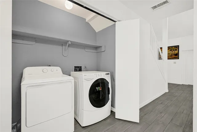 a utility room with dryer and washer