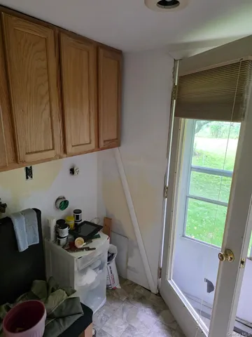a bathroom with a sink and a window