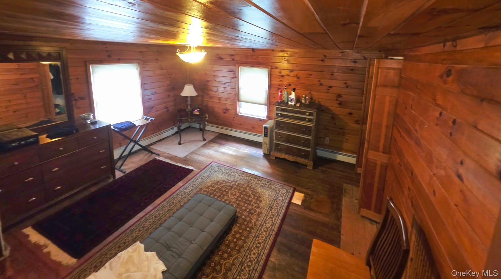 3099 State Rt 17B Cochecton, NY 12726 - Photo 27 of 30 a living room with furniture a flat screen tv and a fireplace