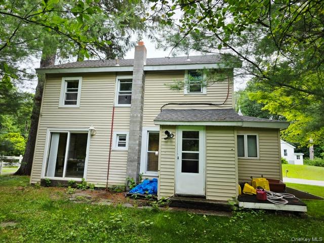 3099 State Rt 17B Cochecton, NY 12726 - Photo 3 of 30 a view of a white house with a yard and a large tree