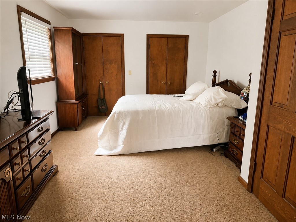 6155 Gibson Road Canfield, OH 44406 - Photo 26 of 43 Carpeted primary bedroom featuring white walls and a window with blinds