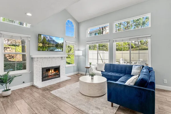 a living room with furniture and a fireplace