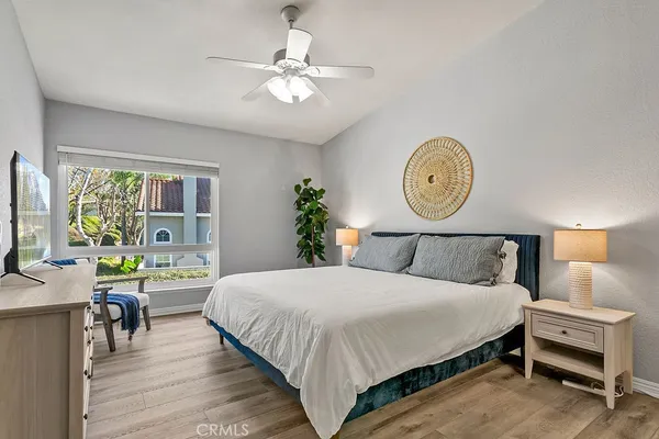 a bedroom with a bed and a dresser