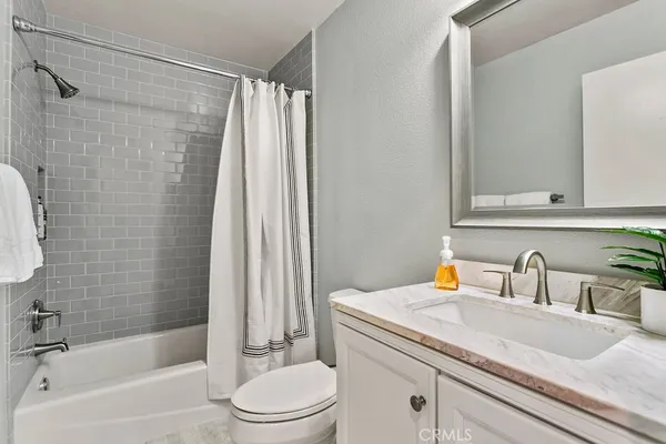 a view of a patio with a table and chairs