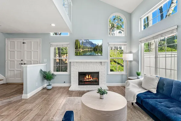a living room with furniture and a fireplace