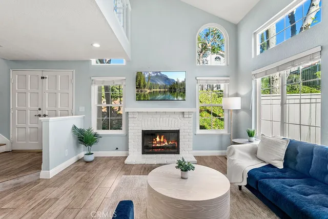 a living room with furniture and a fireplace