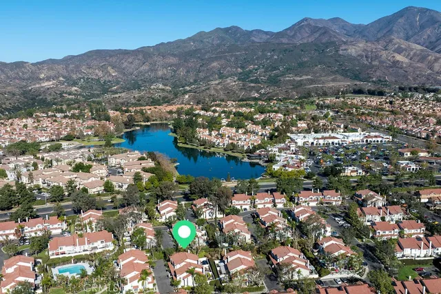 an aerial view of residential houses and outdoor space