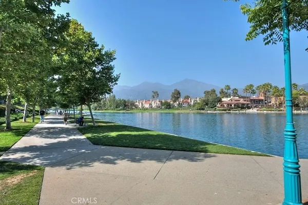 a view of a lake with a table and chairs