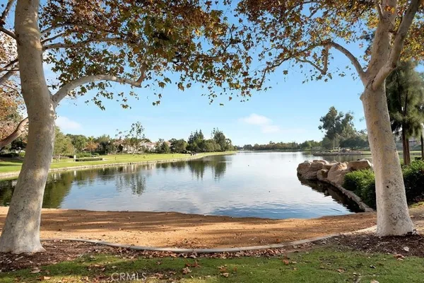 a front view of a building with palm trees