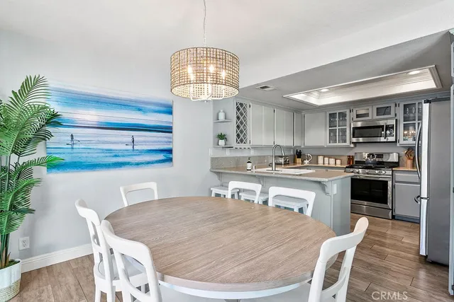 a kitchen with a table and chairs in it