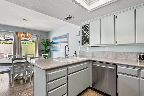 a bathroom with a sink a mirror and toilet